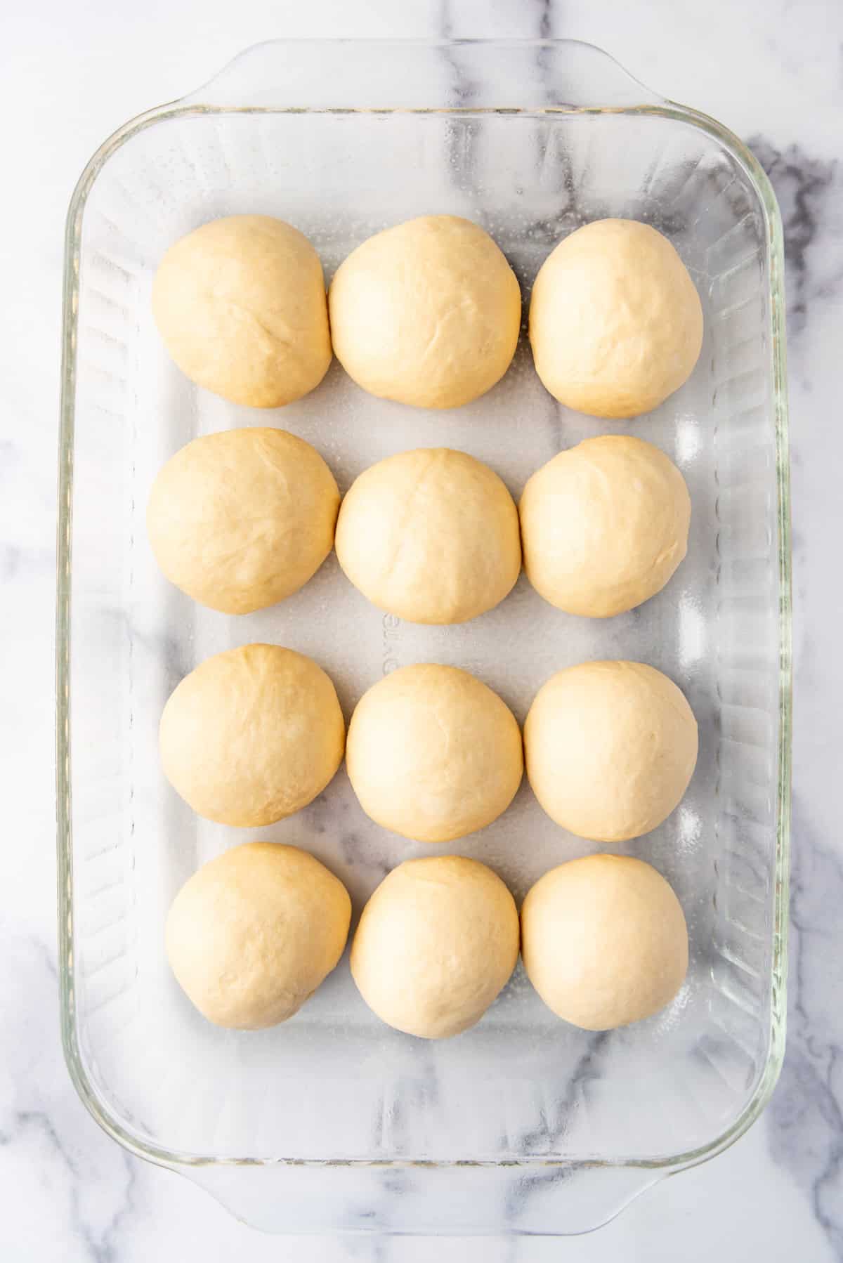 Roll dough in a pan ready to rise before being baked.