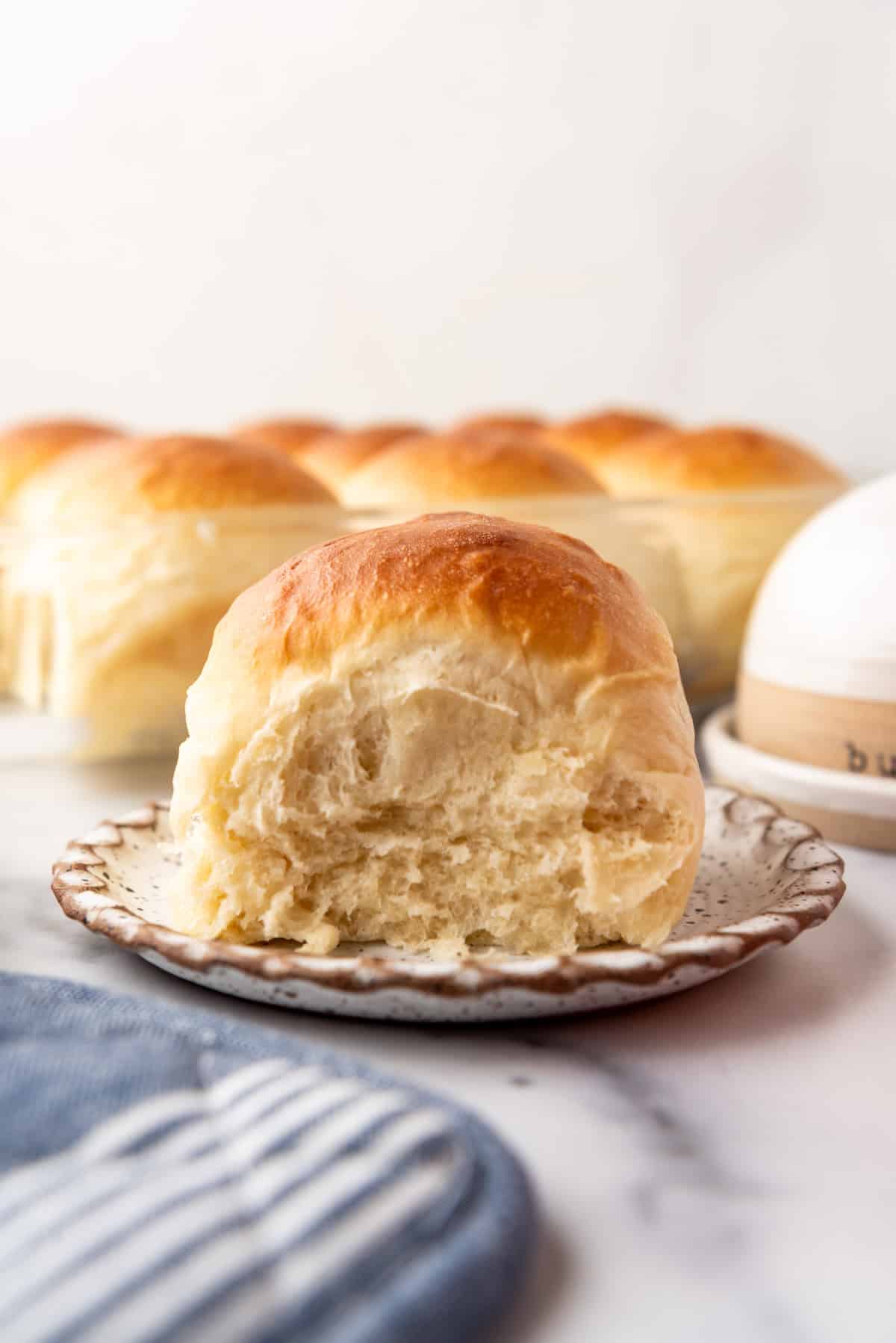 An image of a dinner roll on a plate.