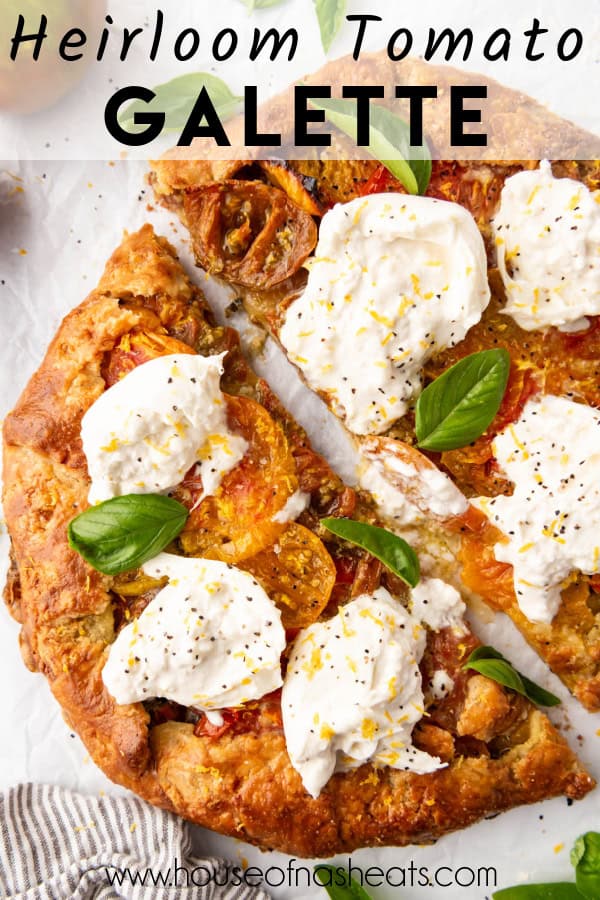 An heirloom tomato galette with burrata cheese and fresh basil leaves on top with text overlay.