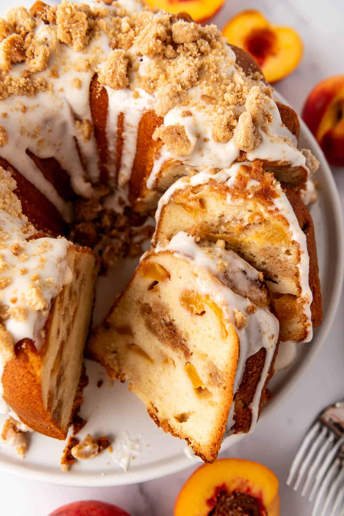 A close image of a sliced peach cobbler pound cake.