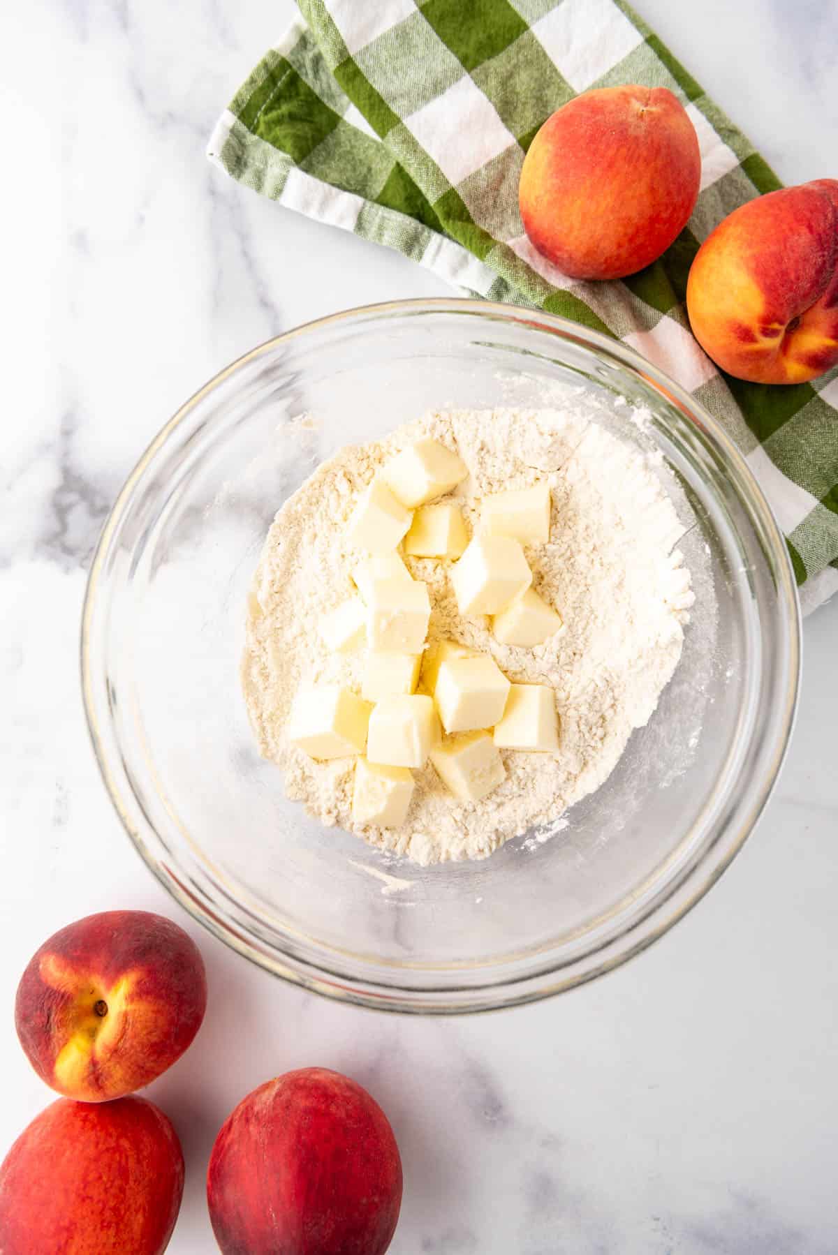 Cold, cubed butter in a bowl of flour for making a pastry crust.