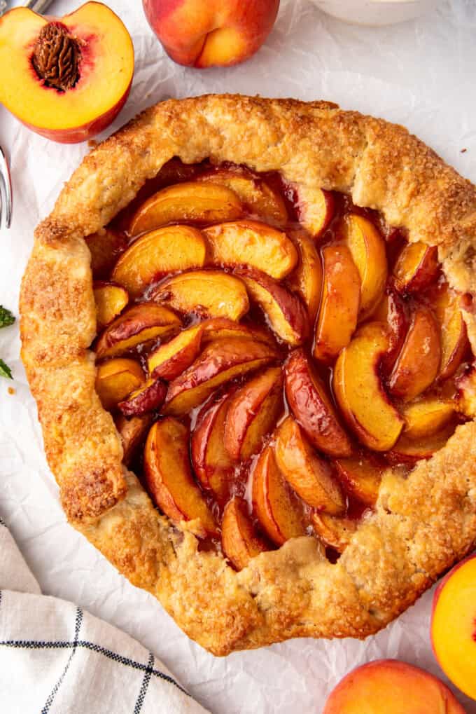 A close up image of a fresh peach galette.