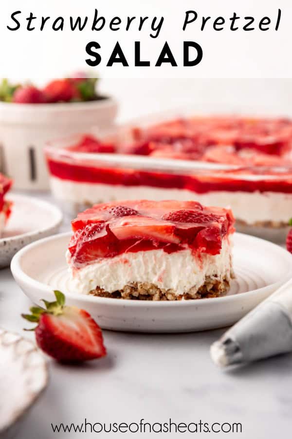 A slice of strawberry pretzel salad on a plate with text overlay.