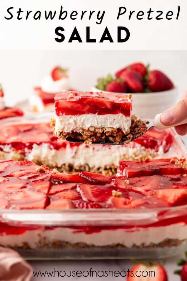 A slice of strawberry pretzel salad being lifted from the pan with text overlay.