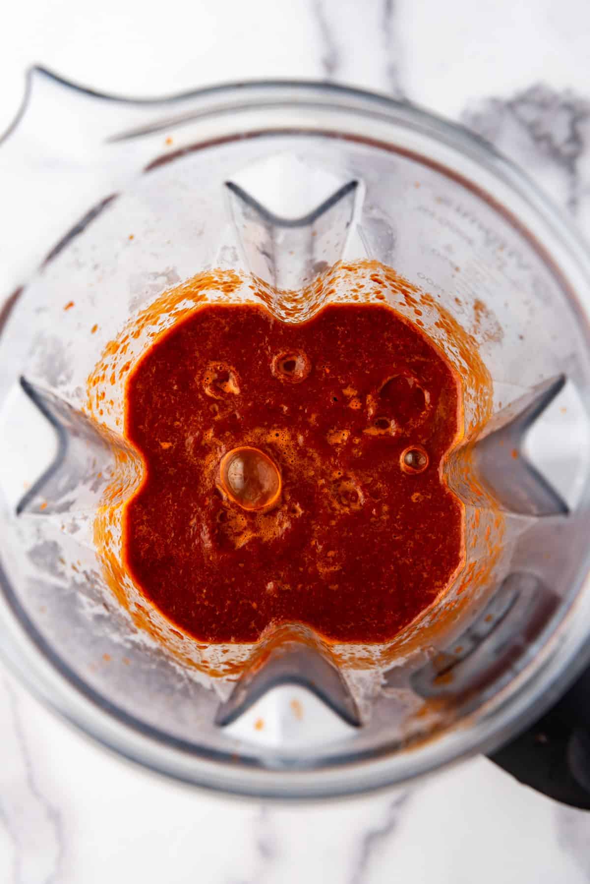 Blended enchilada sauce in a blender.