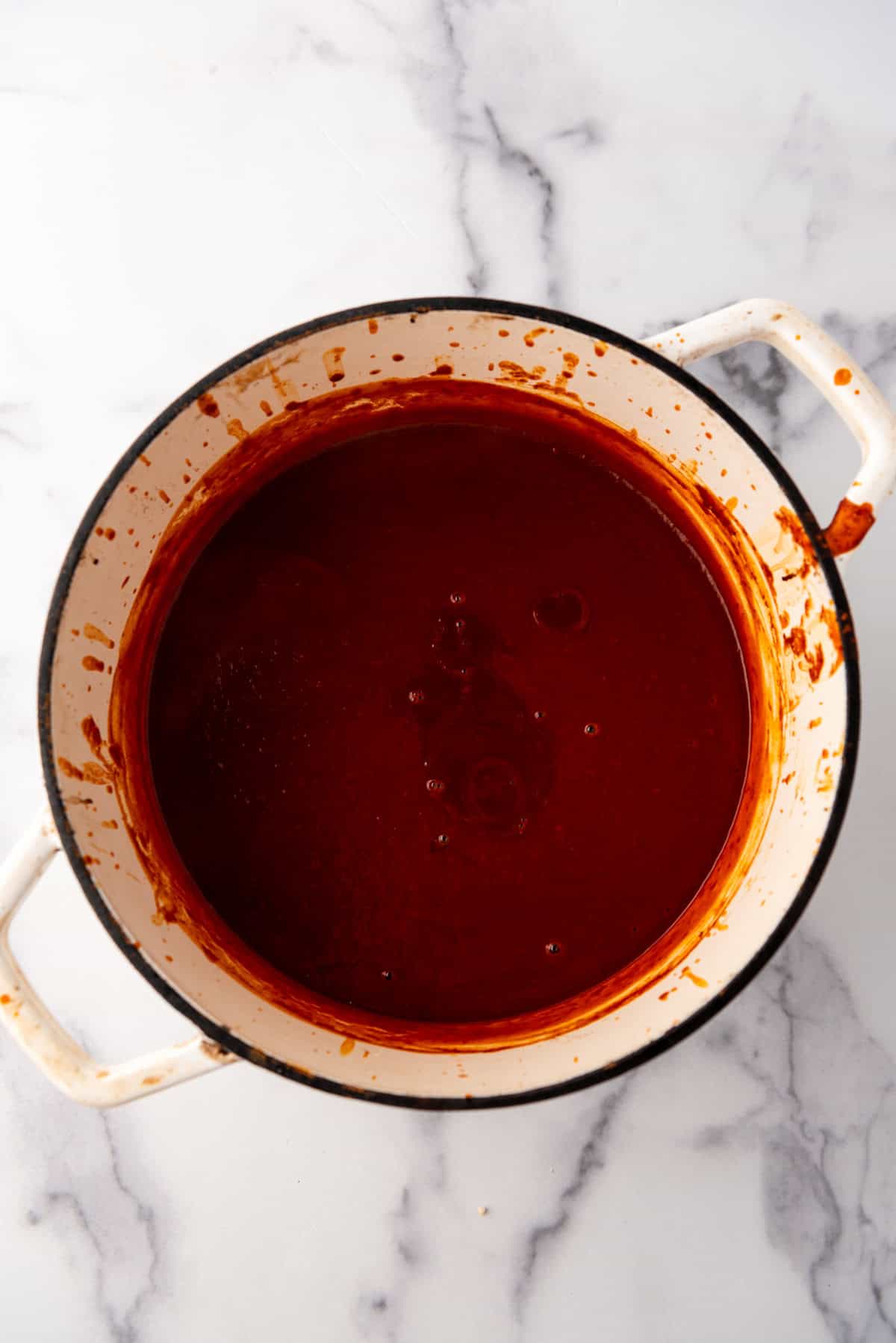 Homemade enchilada sauce in a large dutch oven.