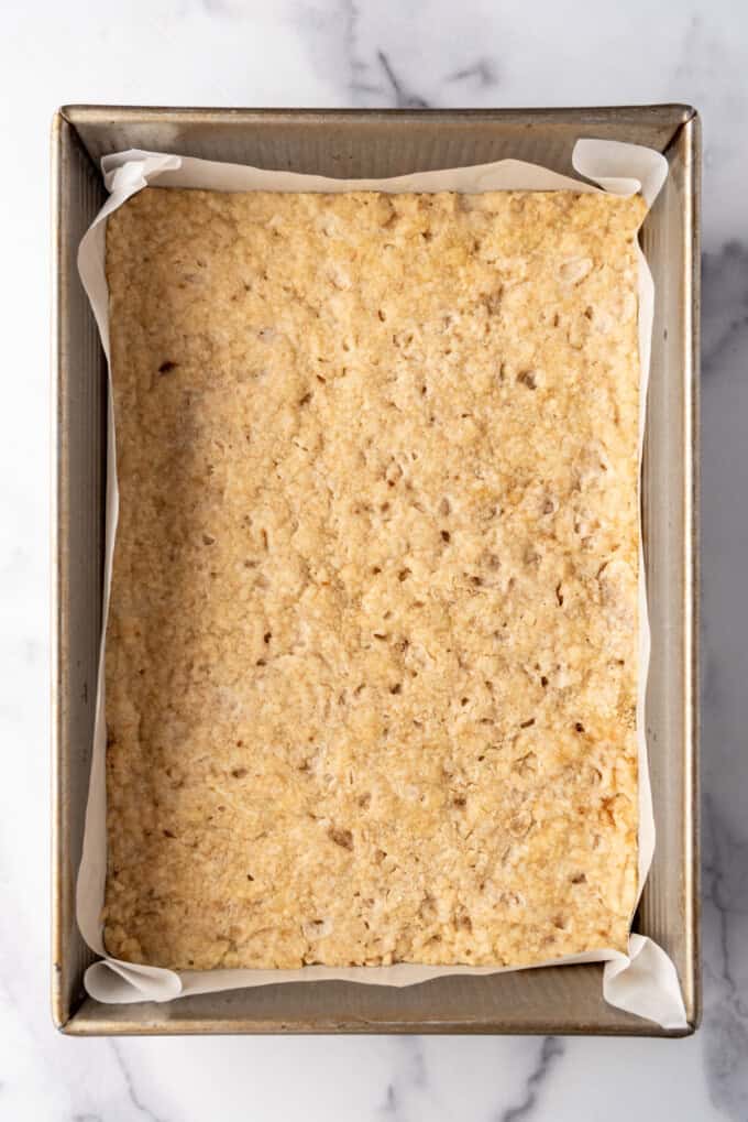 Overhead view of baked crust mixture in a 9x13-inch pan.