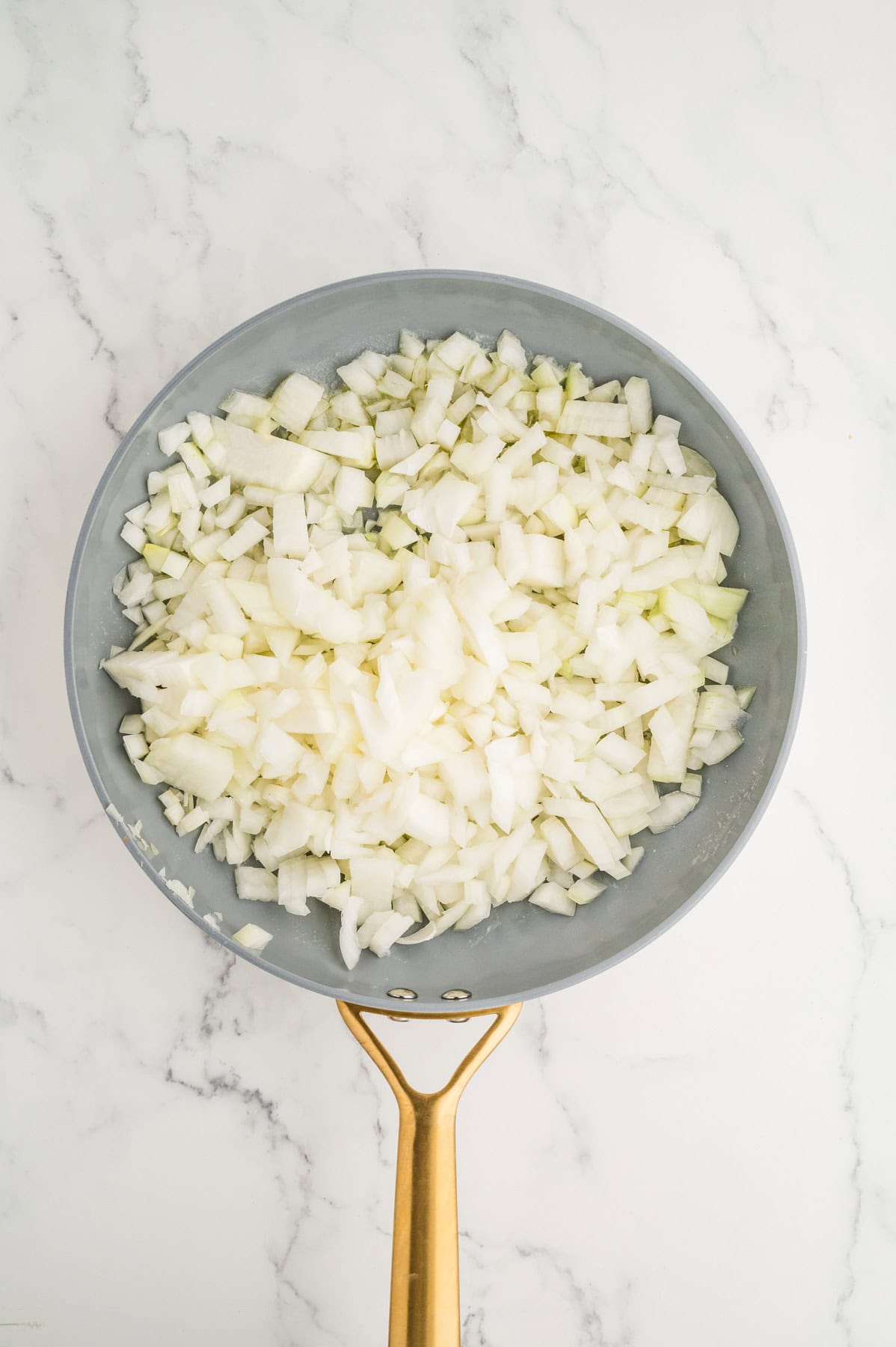 Chopped onions in a large skillet.