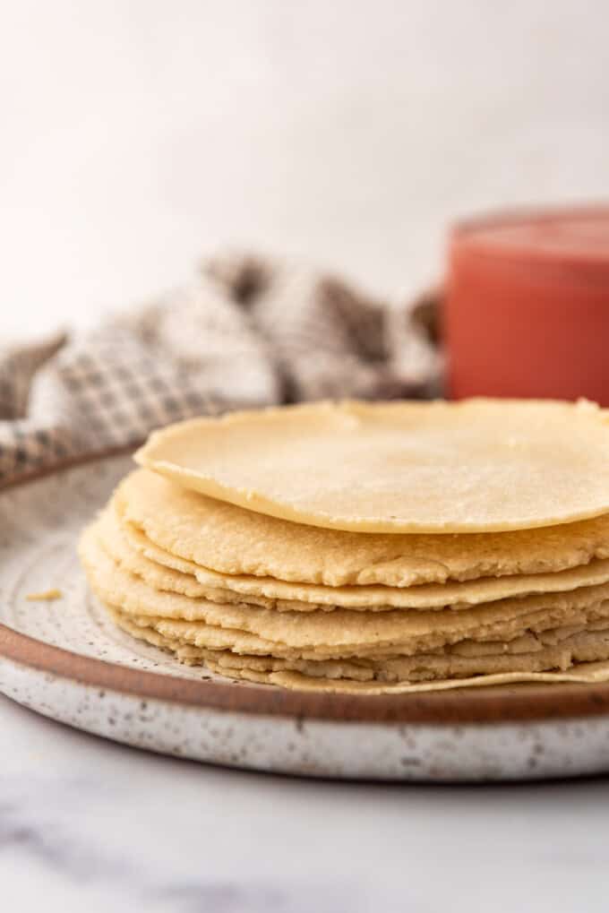 A side image of a stack of homemade corn tortillas.