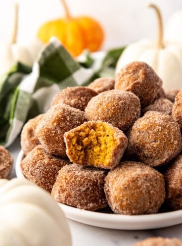 An image of pumpkin donut muffins on a plate.