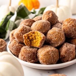 An image of pumpkin donut muffins on a plate.