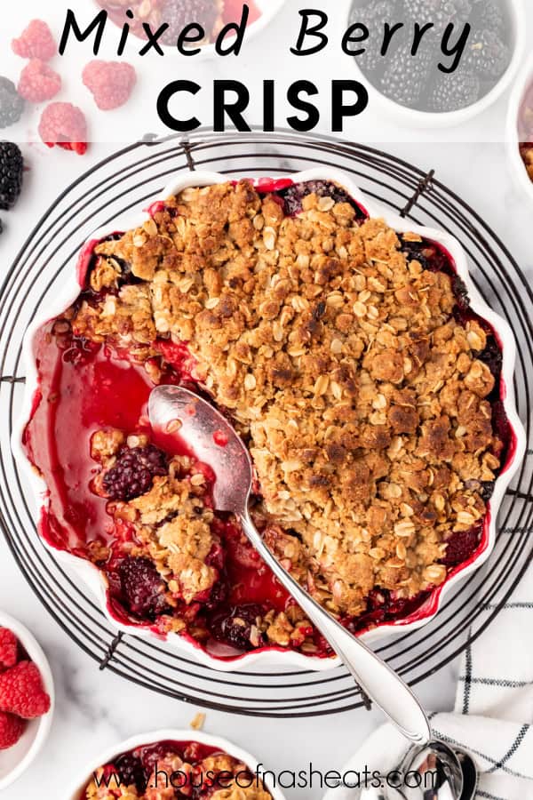 An overhead image of a pan of mixed berry crisp with text overlay.