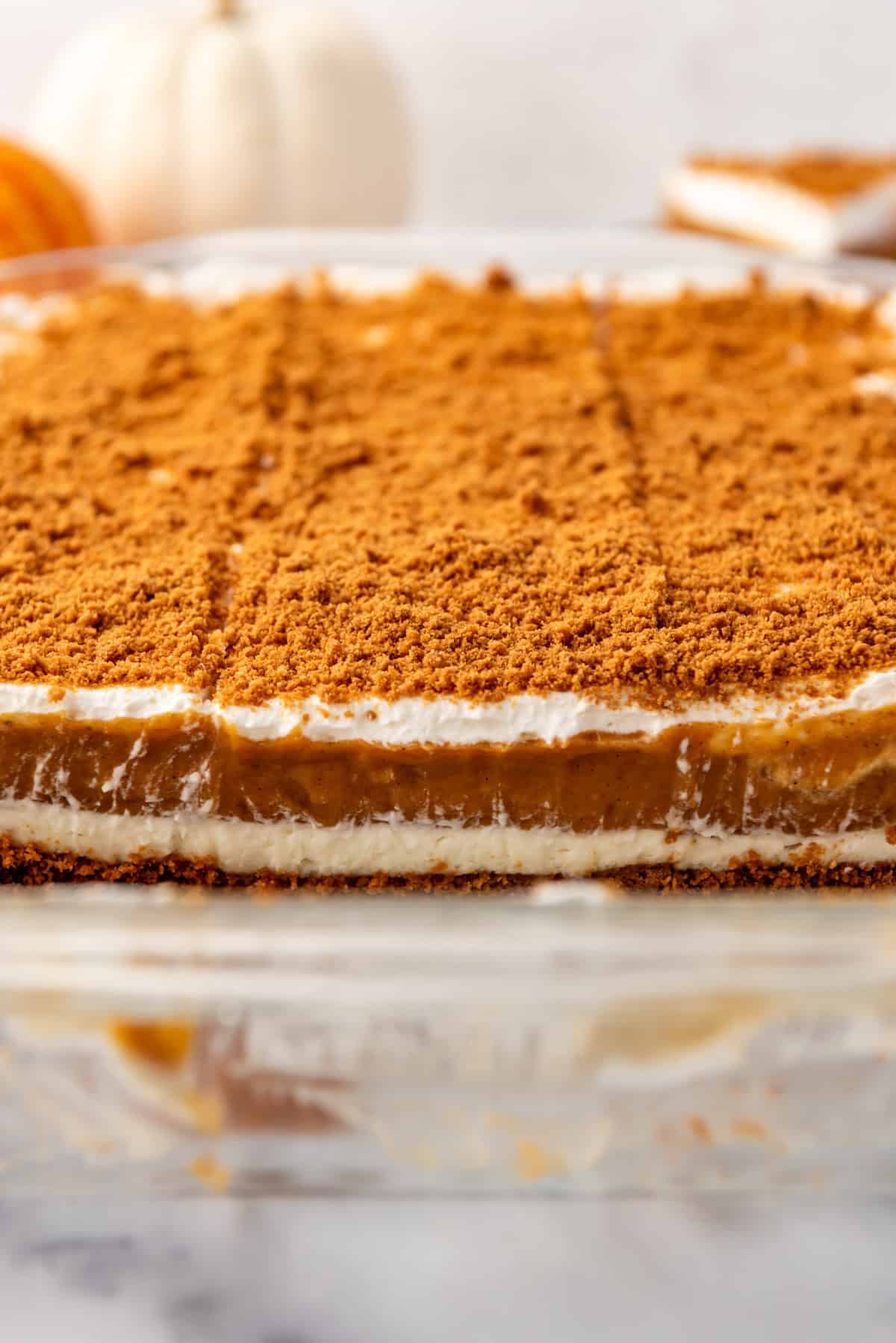 A close up image of the layers of pumpkin delight in a pan.