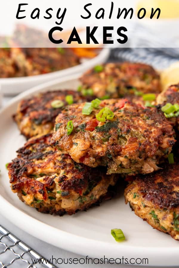 Stacked salmon cakes on a plate with text overlay.