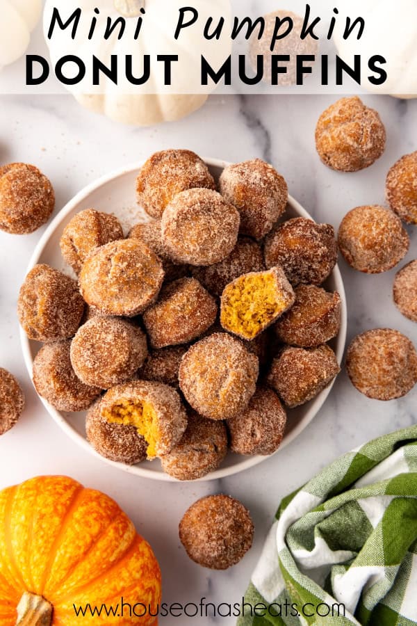 An overhead image of a plate of mini pumpkin donut muffins.