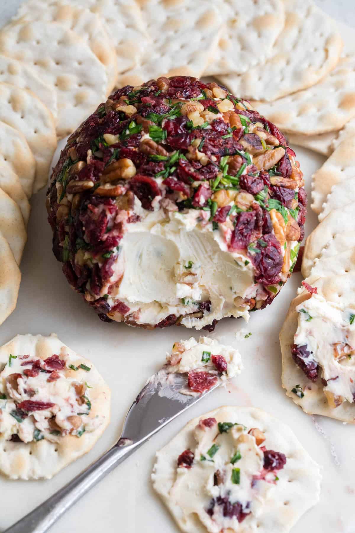 A cheeseball with crackers.