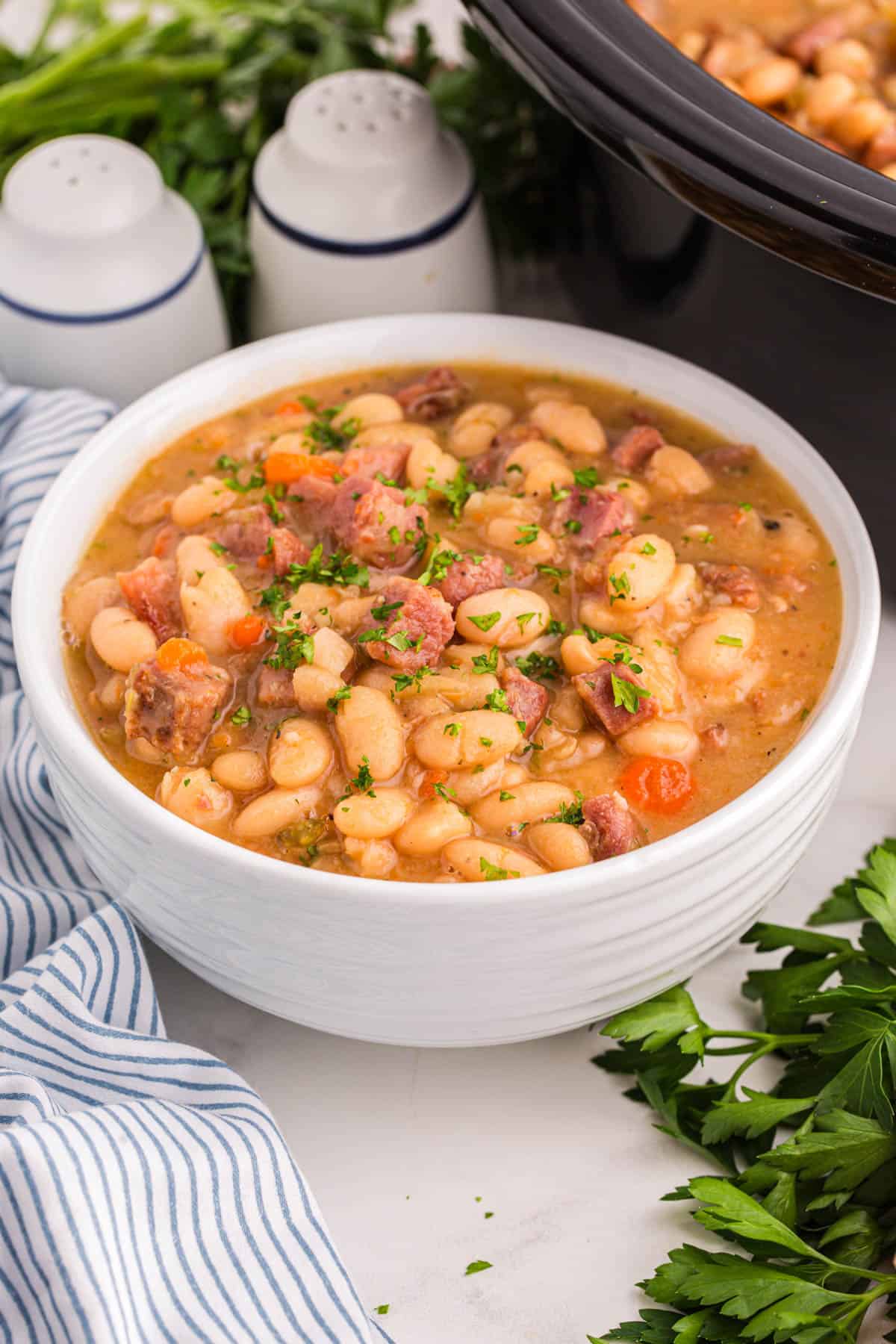 An image of a bowl of ham and bean soup.