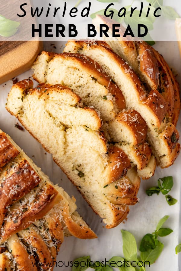 A sliced loaf of swirled garlic herb bread with text overlay.