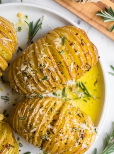 A close up image of roasted hasselback potatoes.