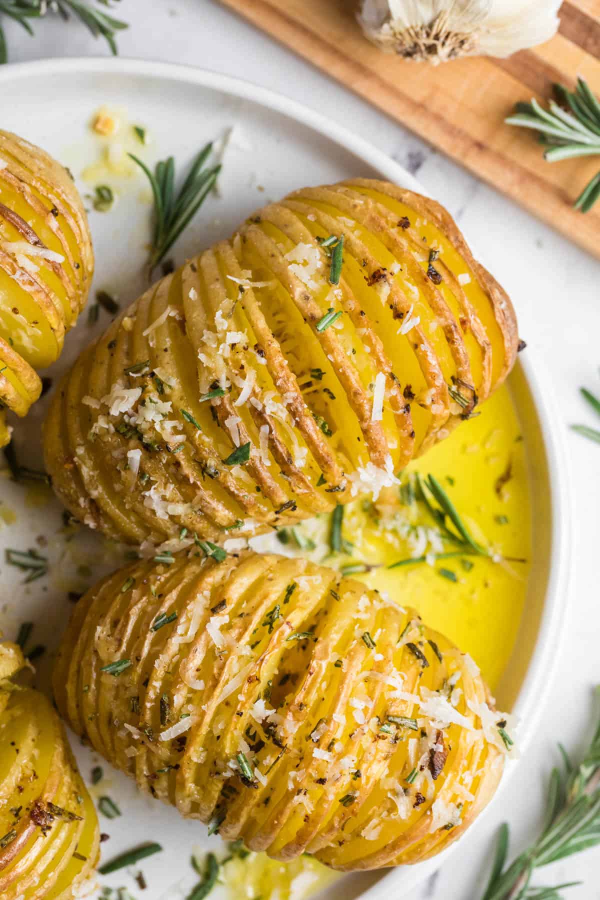 A close up image of roasted hasselback potatoes.