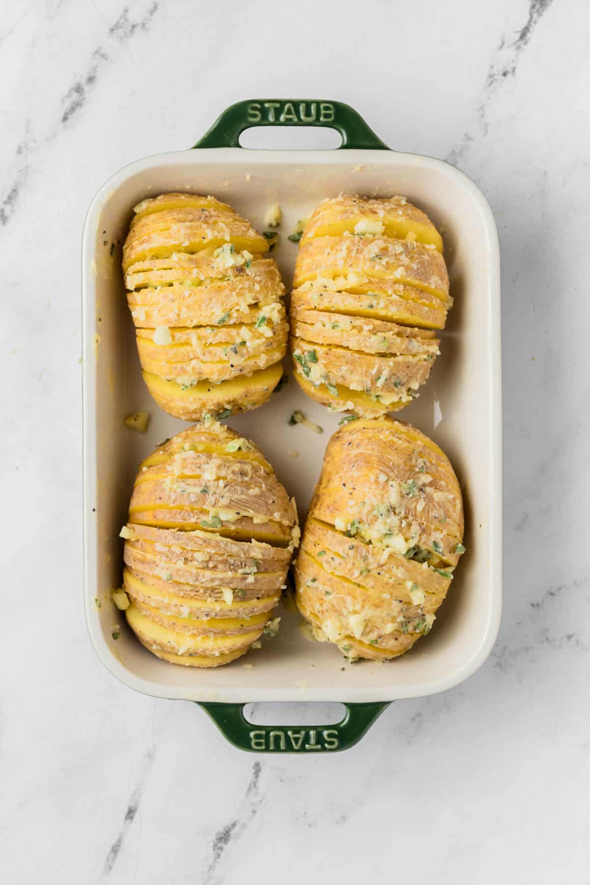 Thinly sliced whole potatoes brushed with garlic and butter.