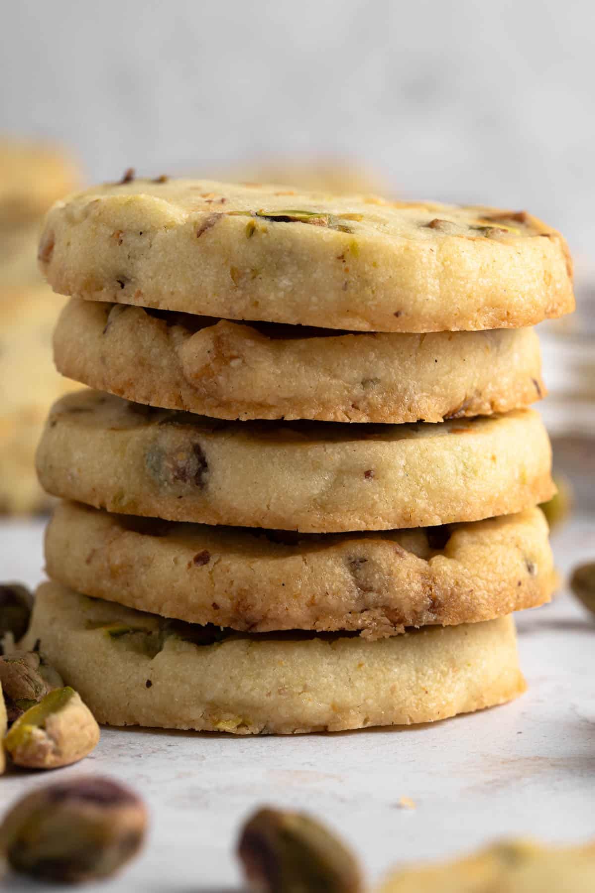 Close up view of a stack of Pistachio Shortbread cookies.