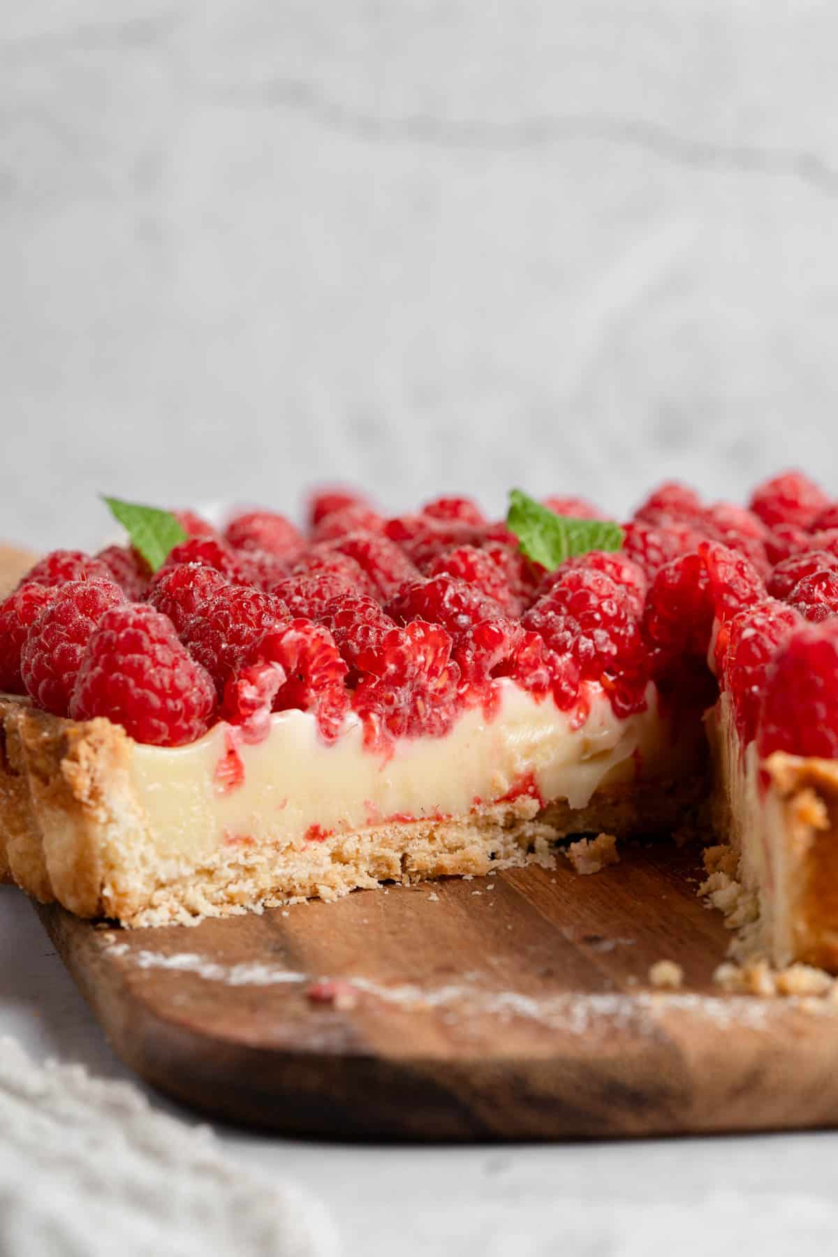 A cross-section of a raspberry tart.