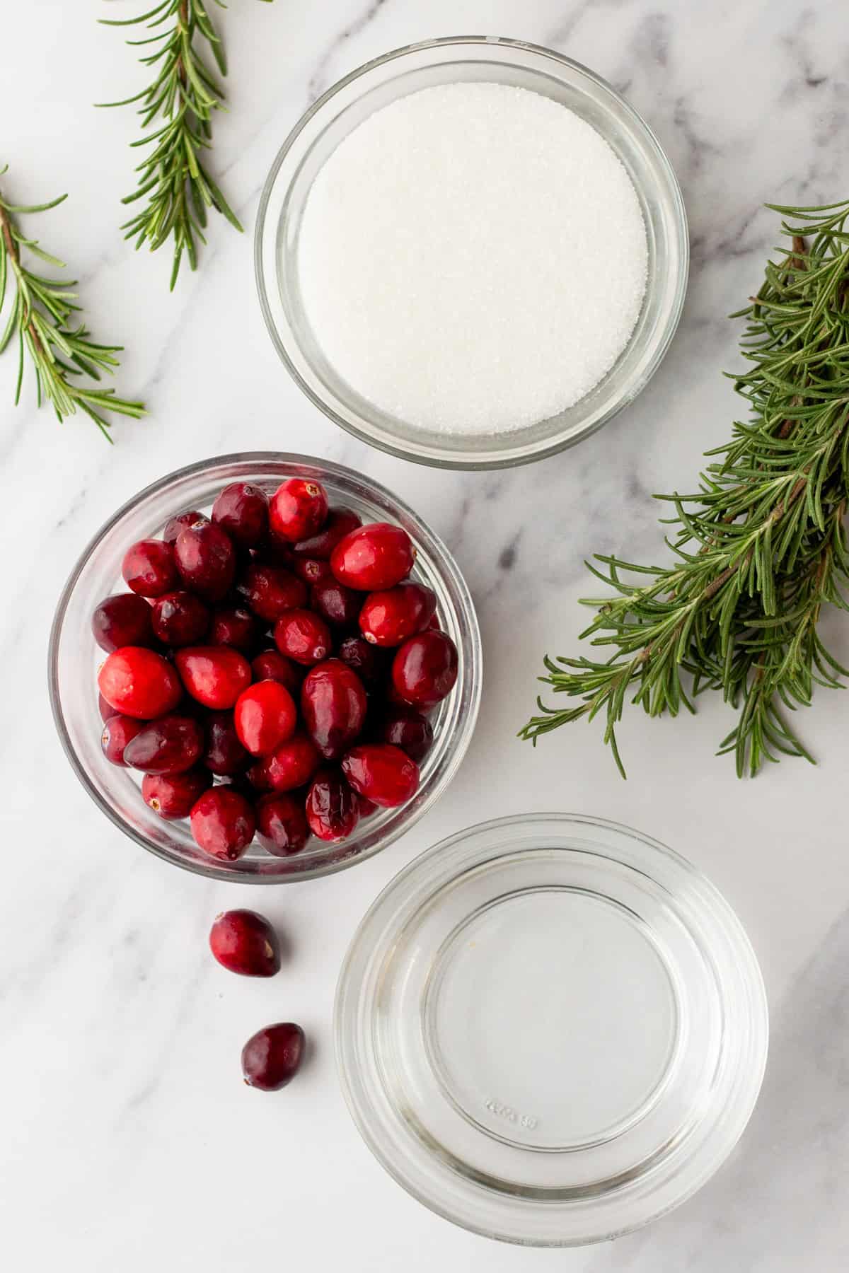 Ingredients for making sugared cranberries and sugared rosemary. 