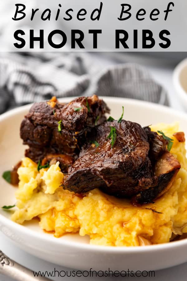 Braised beef short ribs on top of mashed potatoes with text overlay.