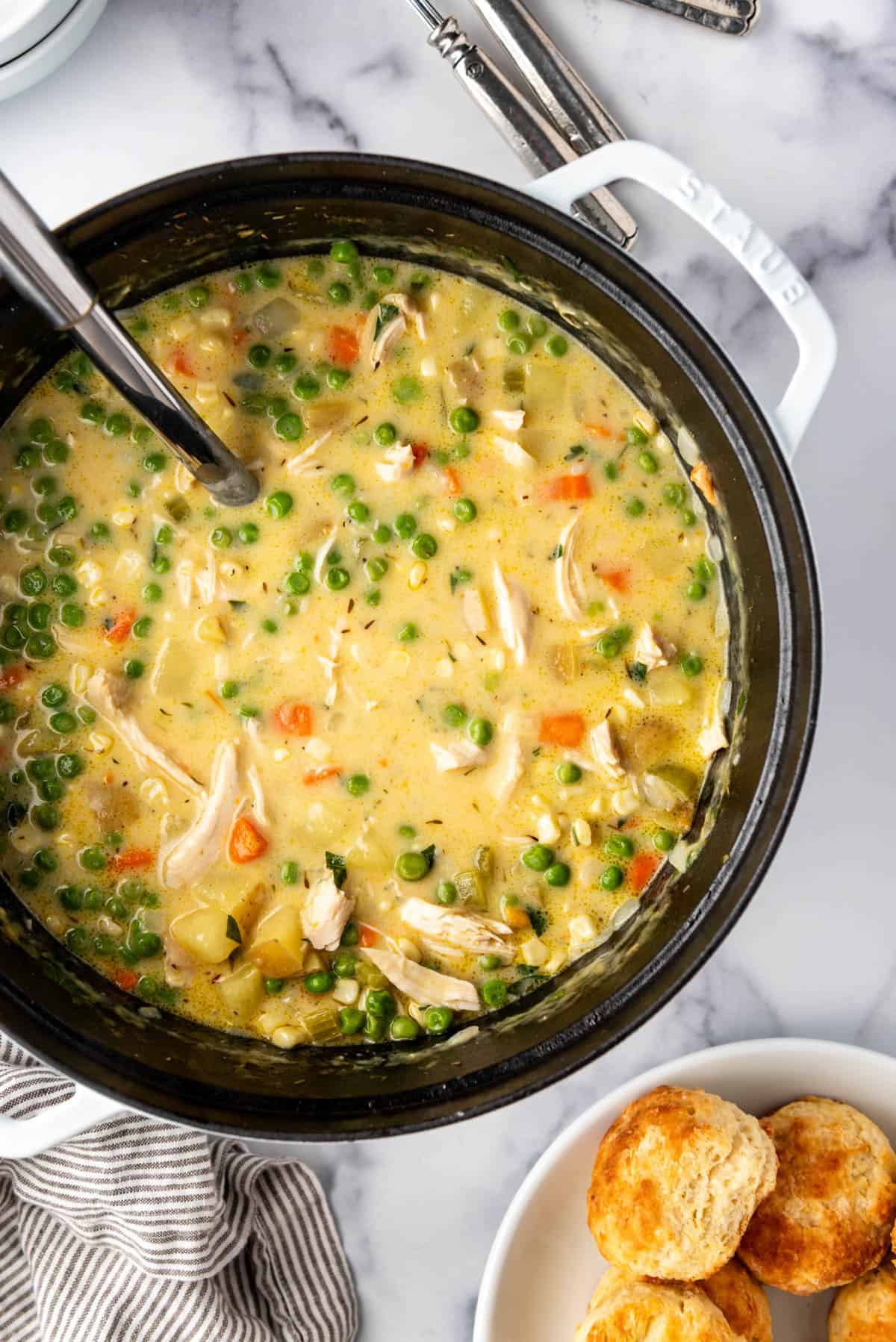 An overhead image of a pot of chicken pot pie soup.