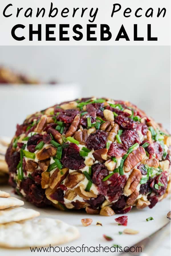 A cranberry pecan cheeseball with text overlay.