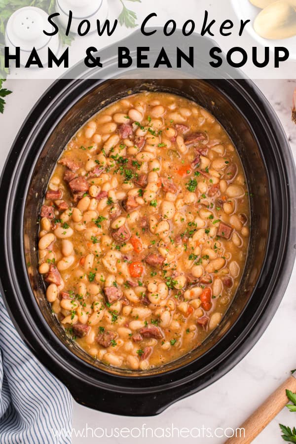 An overhead image of a slow cooker full of ham and bean soup with text overlay.