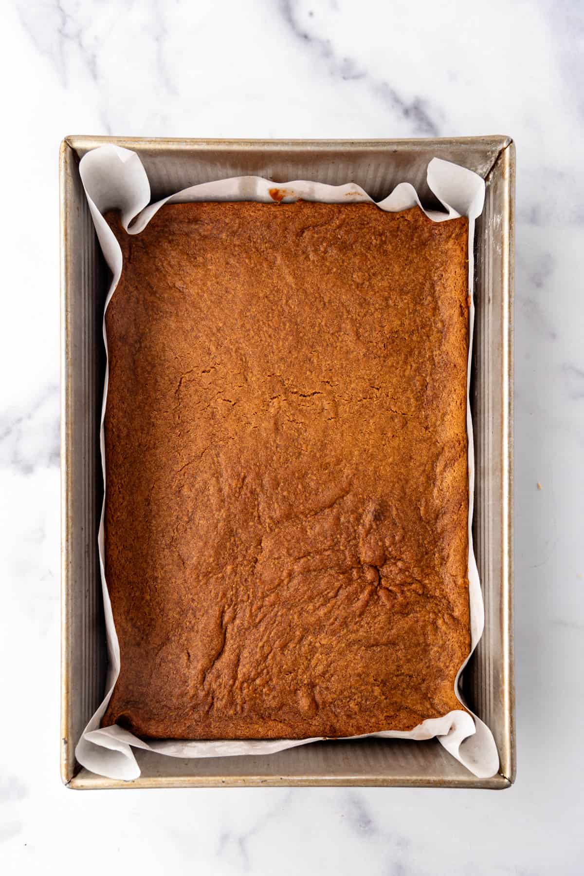 Baked gingerbread bars in a pan.