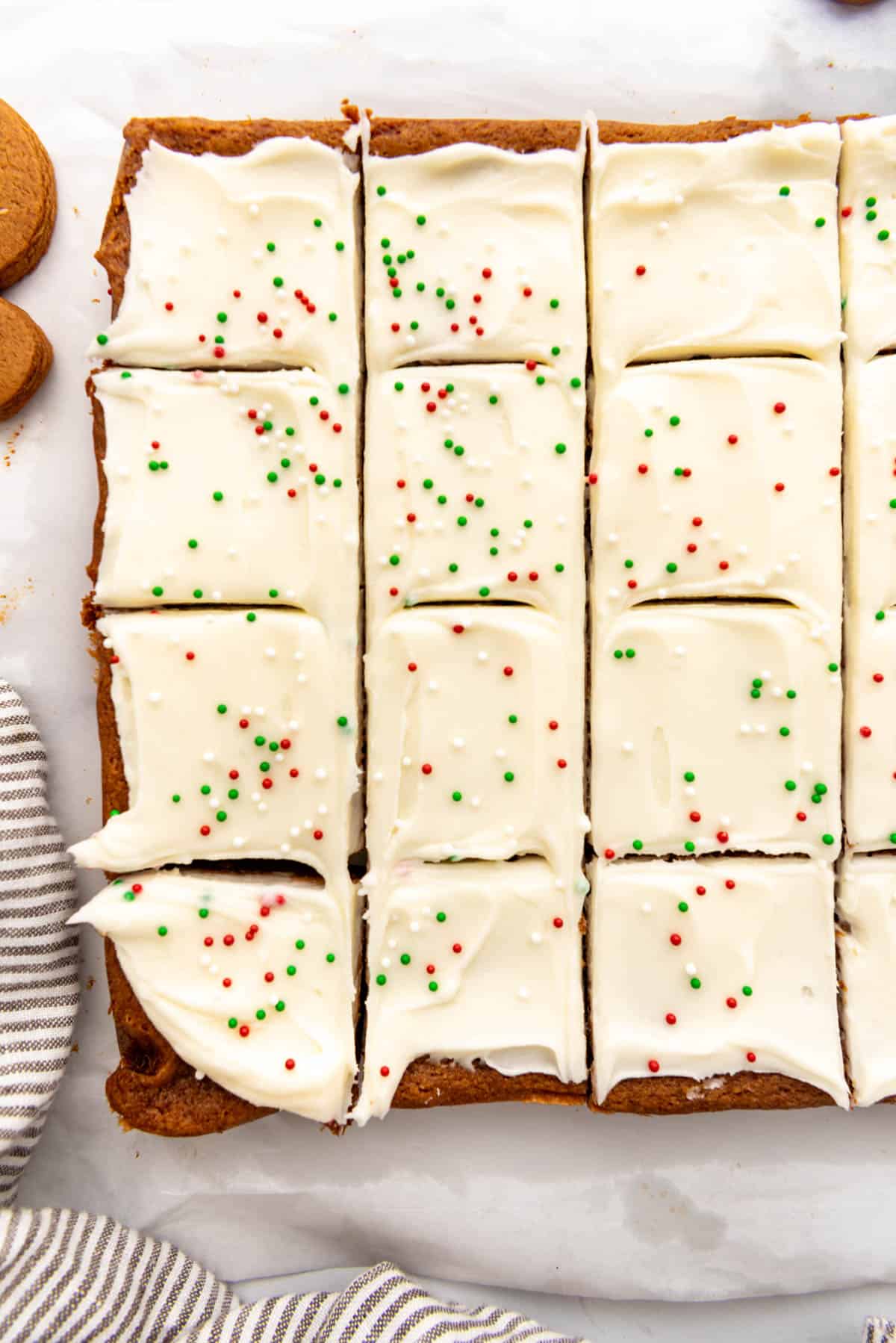 Frosted gingerbread bars with red, green, and white sprinkles.