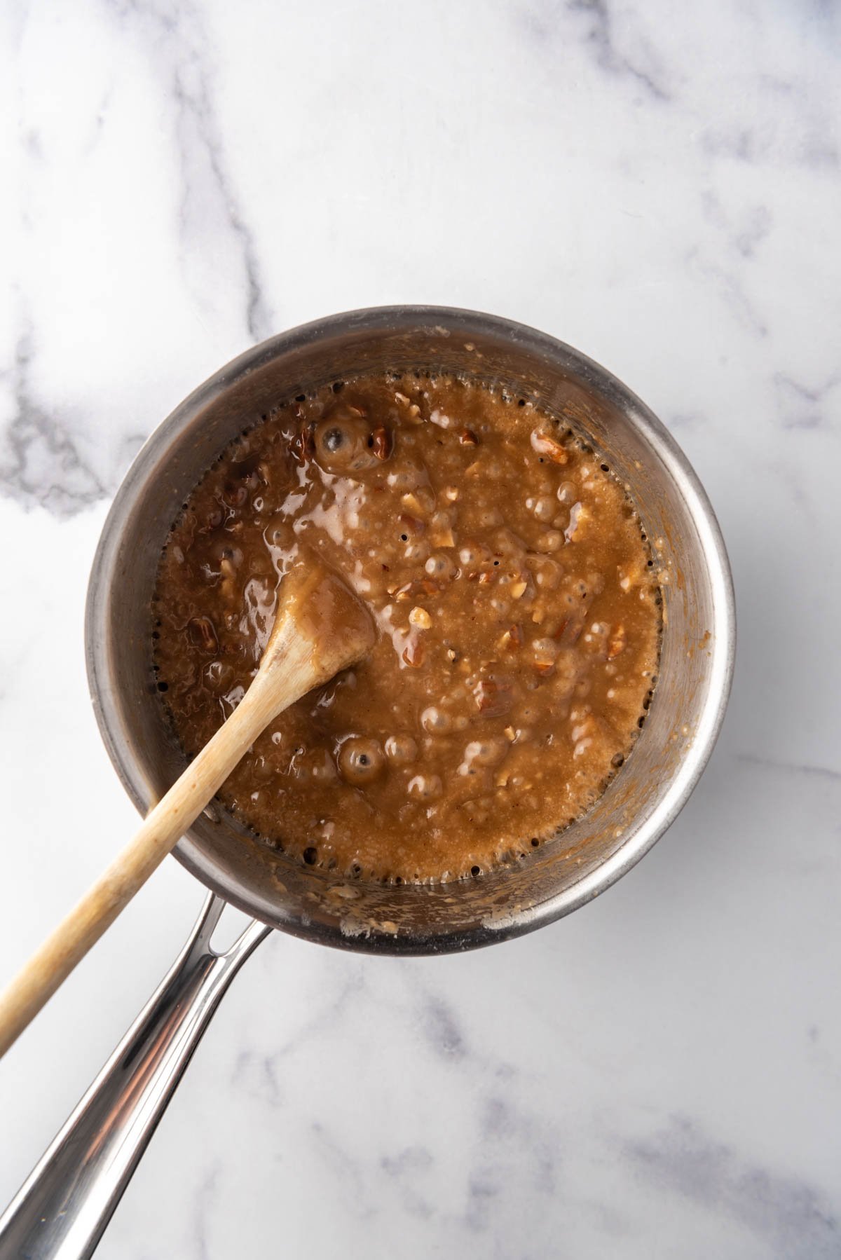 Pecan toffee filling in a saucepan.