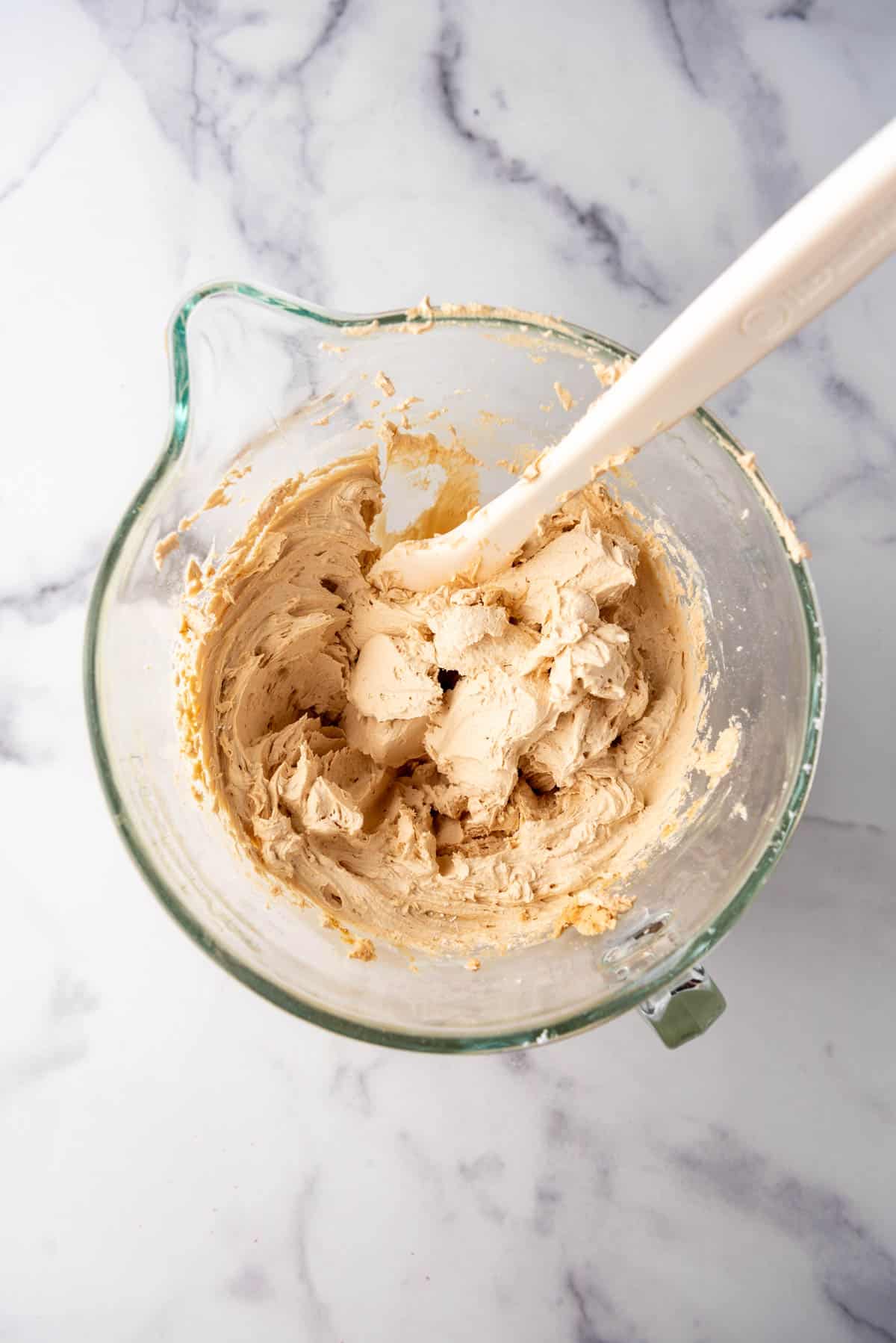 Cookie butter frosting in a mixing bowl.