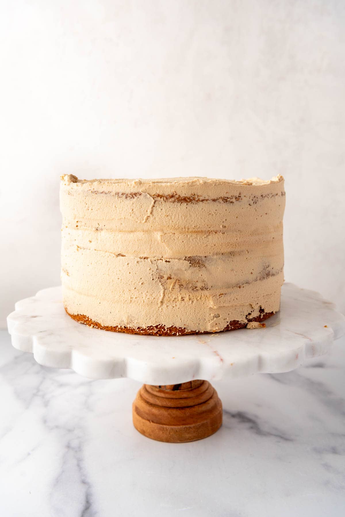 A crumb coat on a biscoff cookie butter cake.