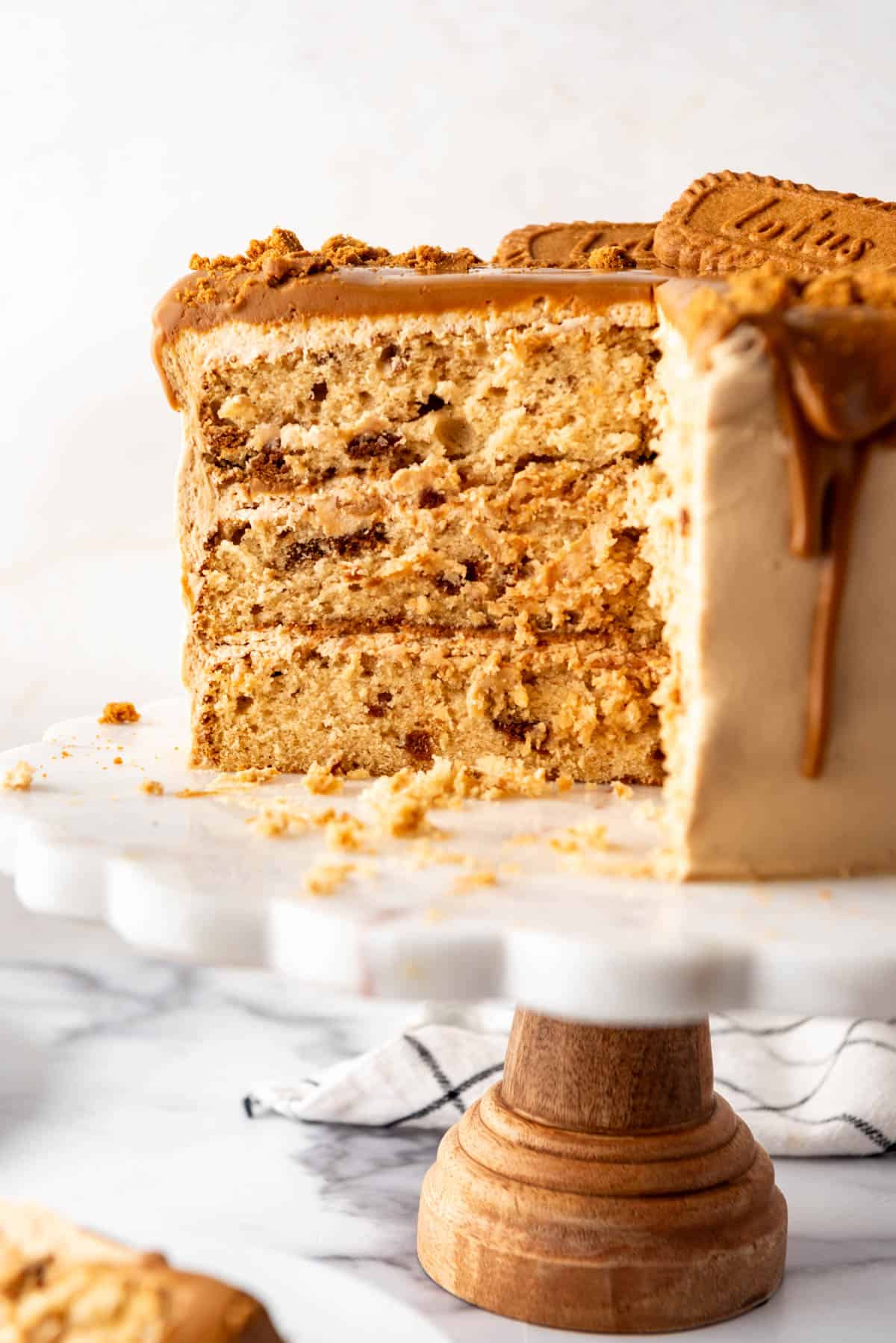 A cross section of a three-layer cookie butter cake.