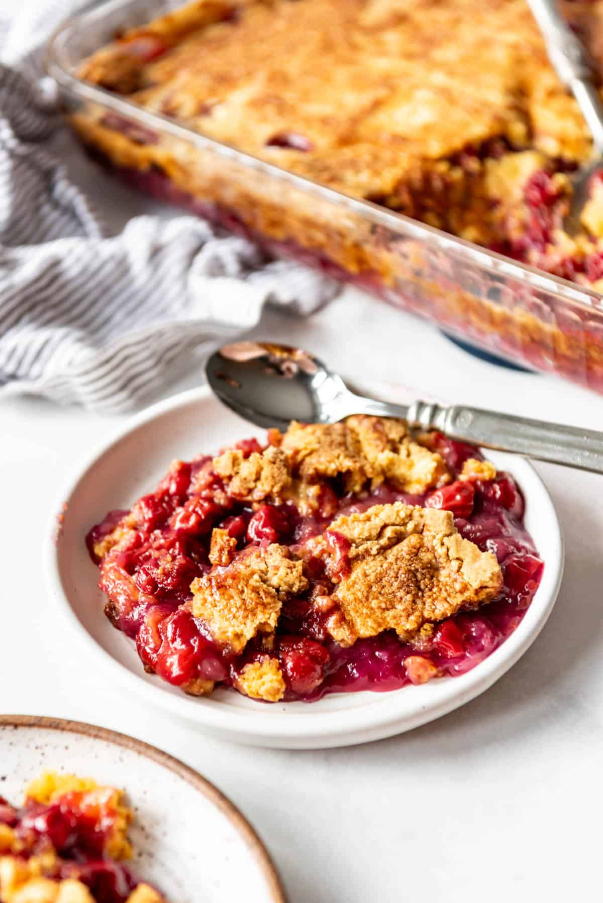 A plate of cherry pineapple dump cake.