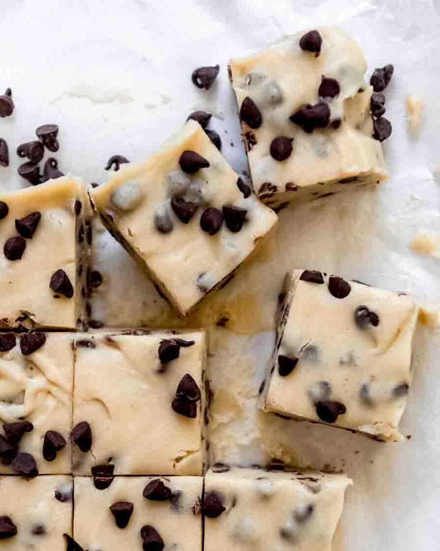 Squares of chocolate chip cookie dough fudge that have just been sliced.