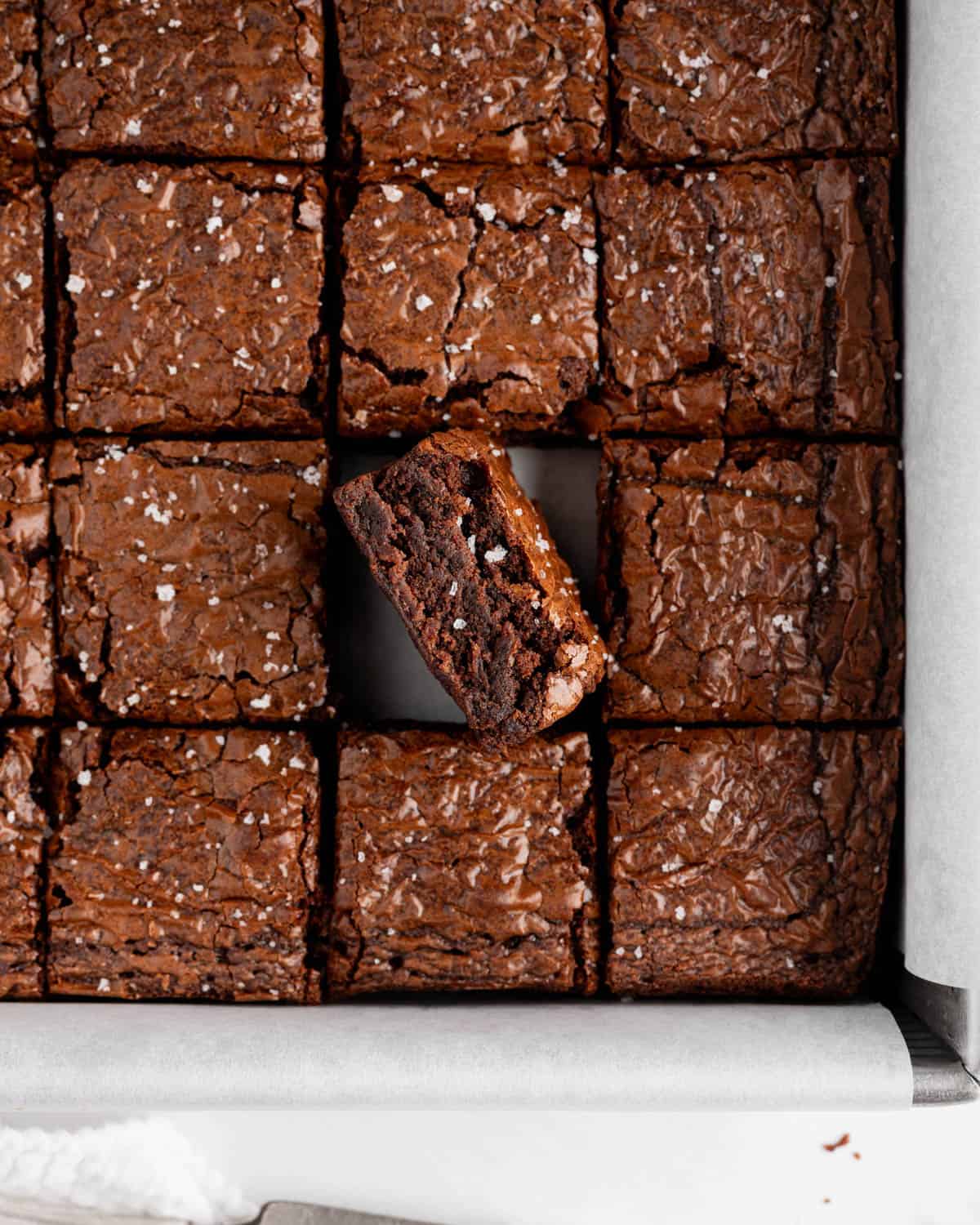 Brownies cut into squares with one turned on its side.