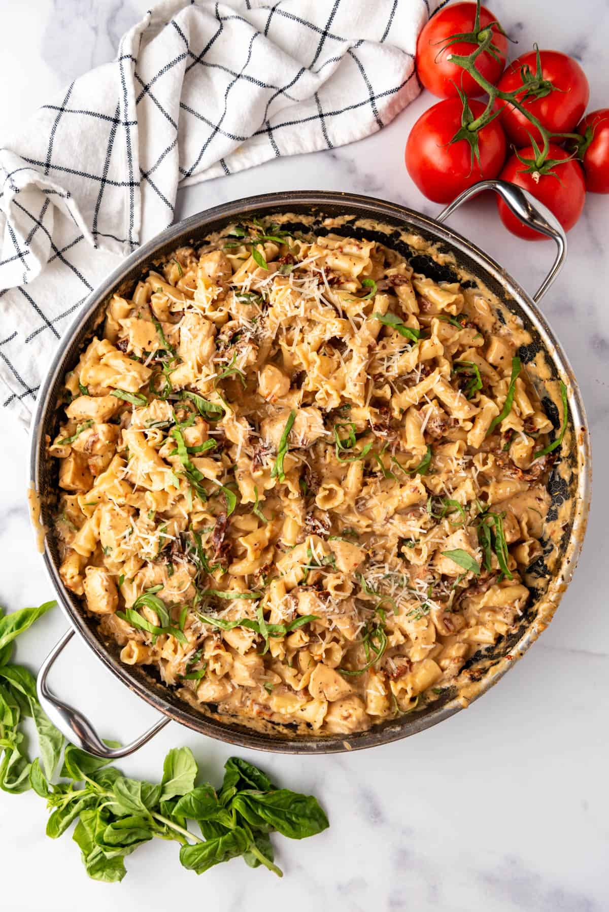 An overhead image of a large skillet of marry me chicken pasta.