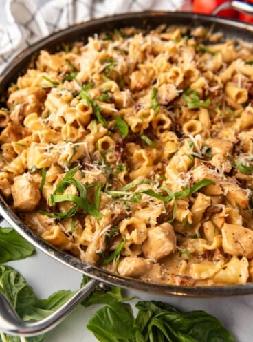 A side view of a pan of marry me chicken pasta.