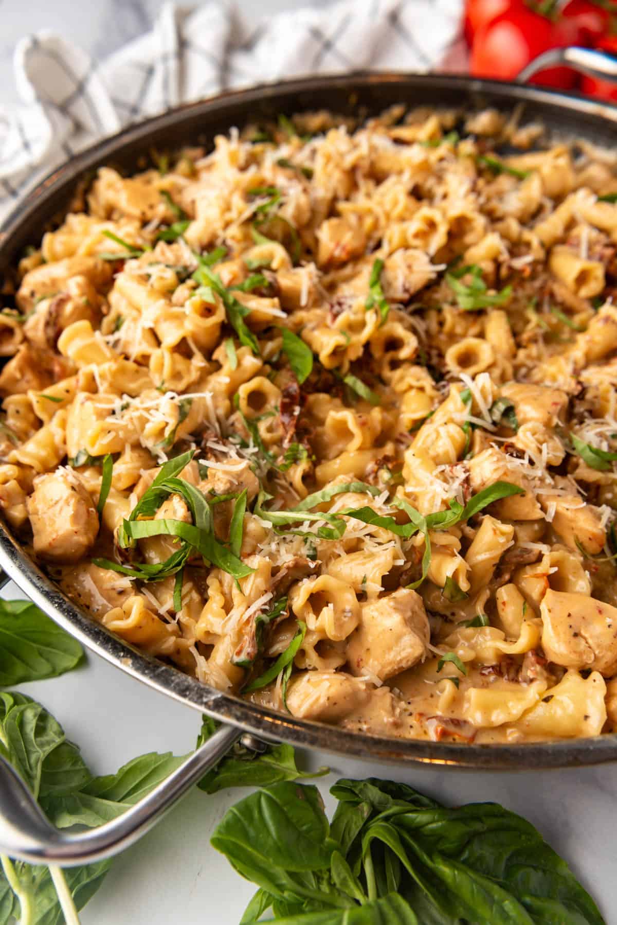 A side view of a pan of marry me chicken pasta.