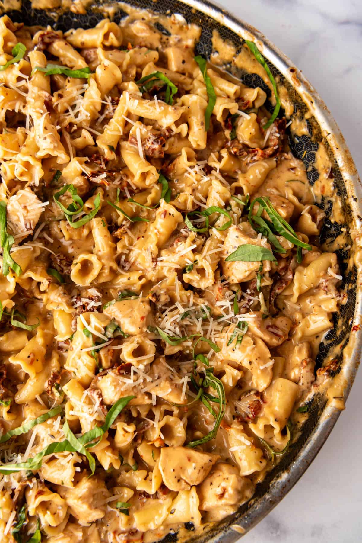 An overhead image of a pan of marry me chicken pasta.