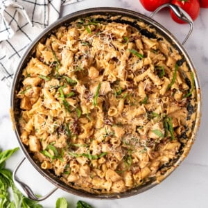 An overhead image of a large skillet of marry me chicken pasta.