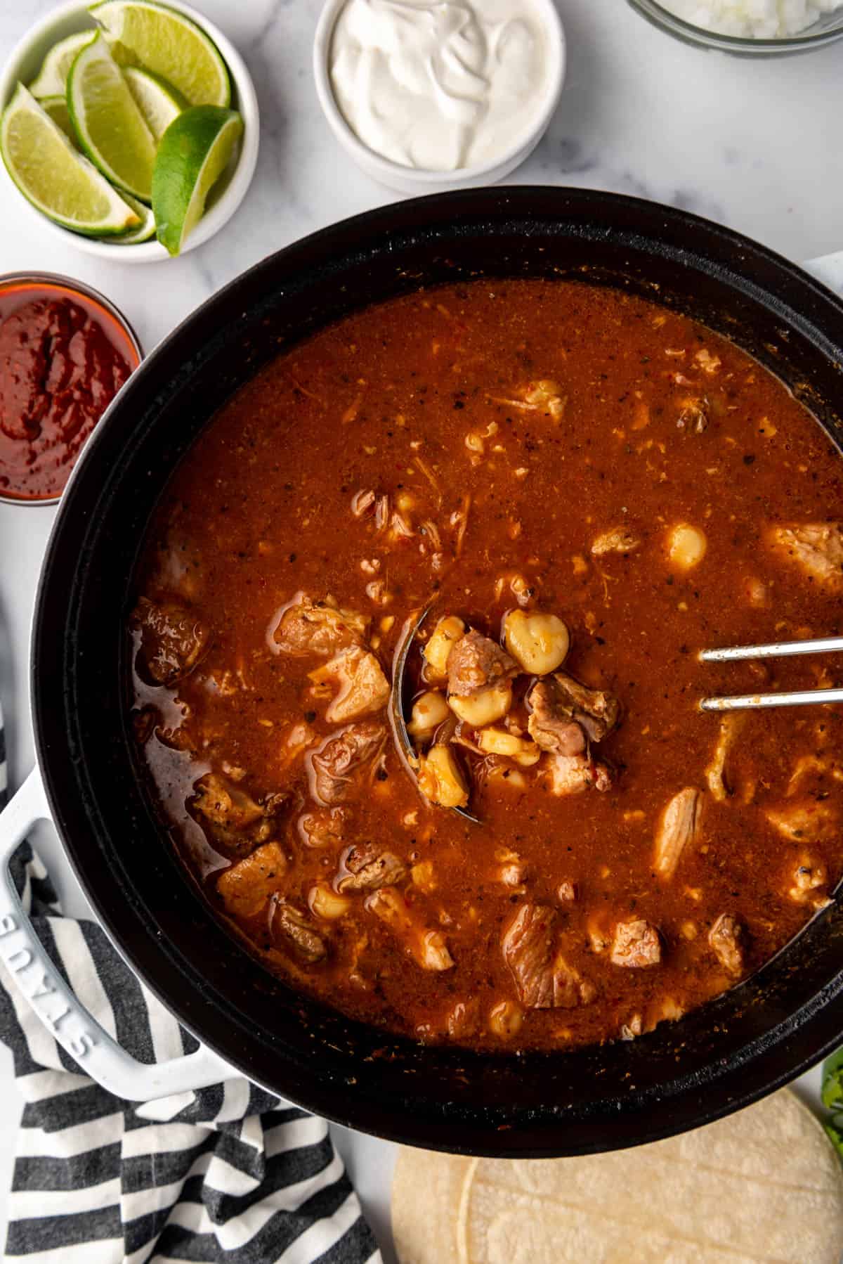 An overhead image of a large pot of New Mexican Posole.