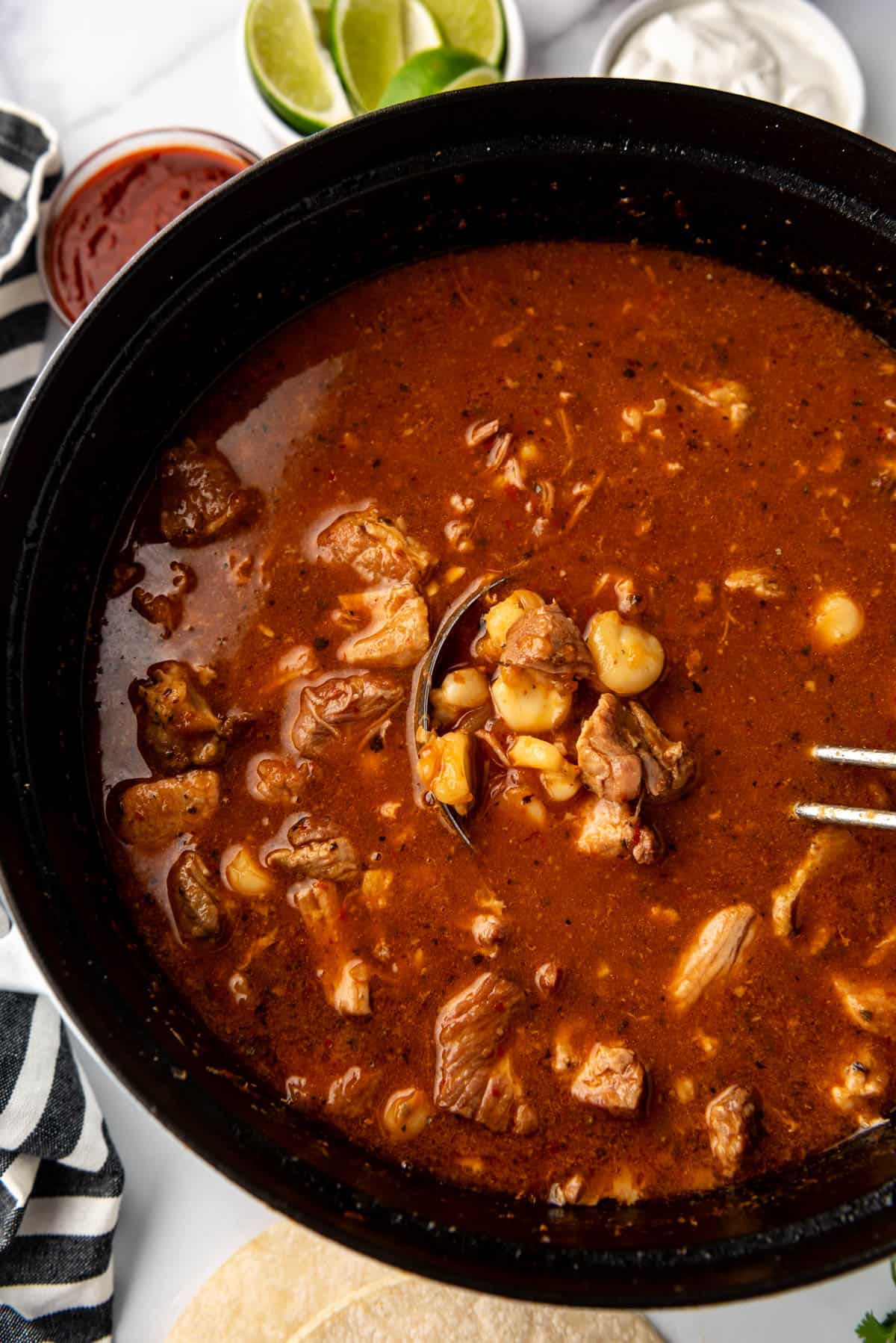 A close overhead image of a pot of posole.