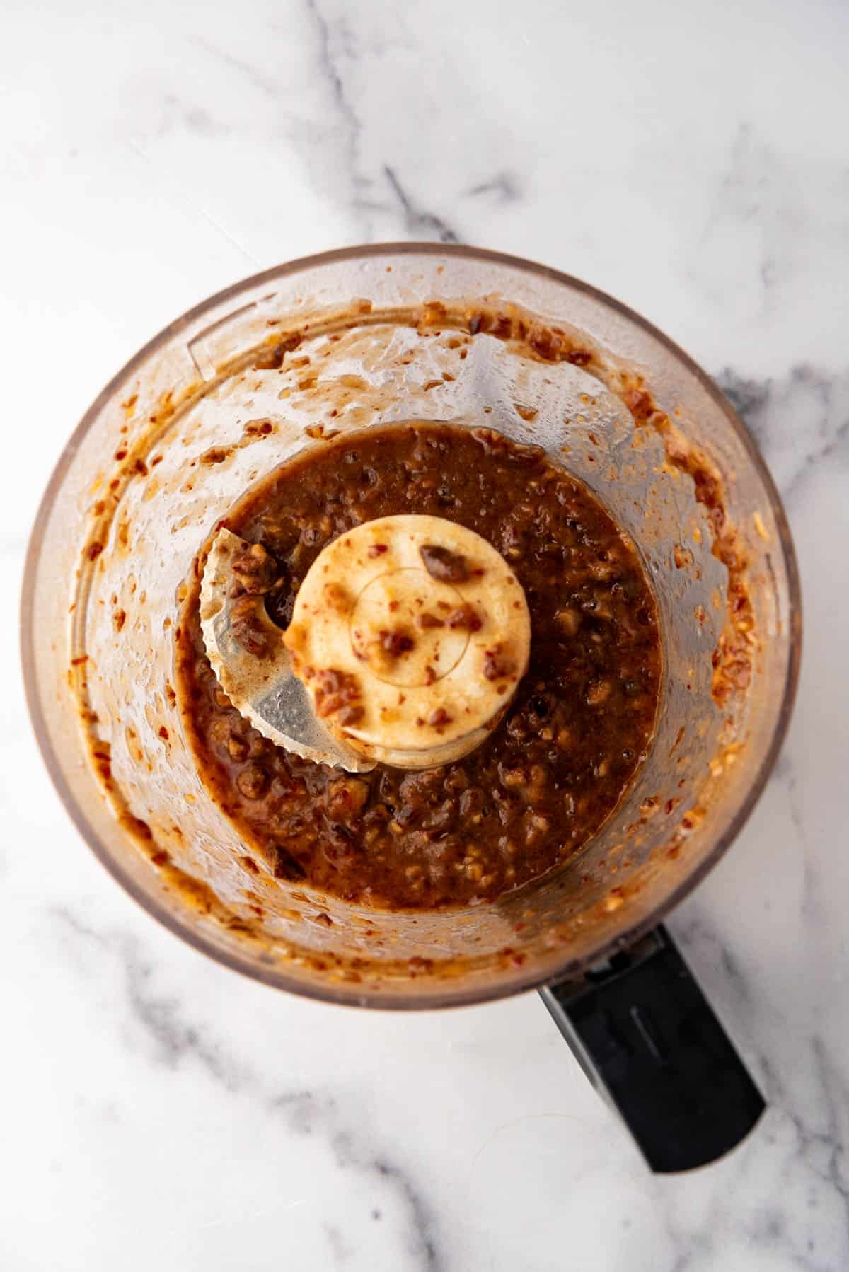 Finely chopped dates in a food processor.