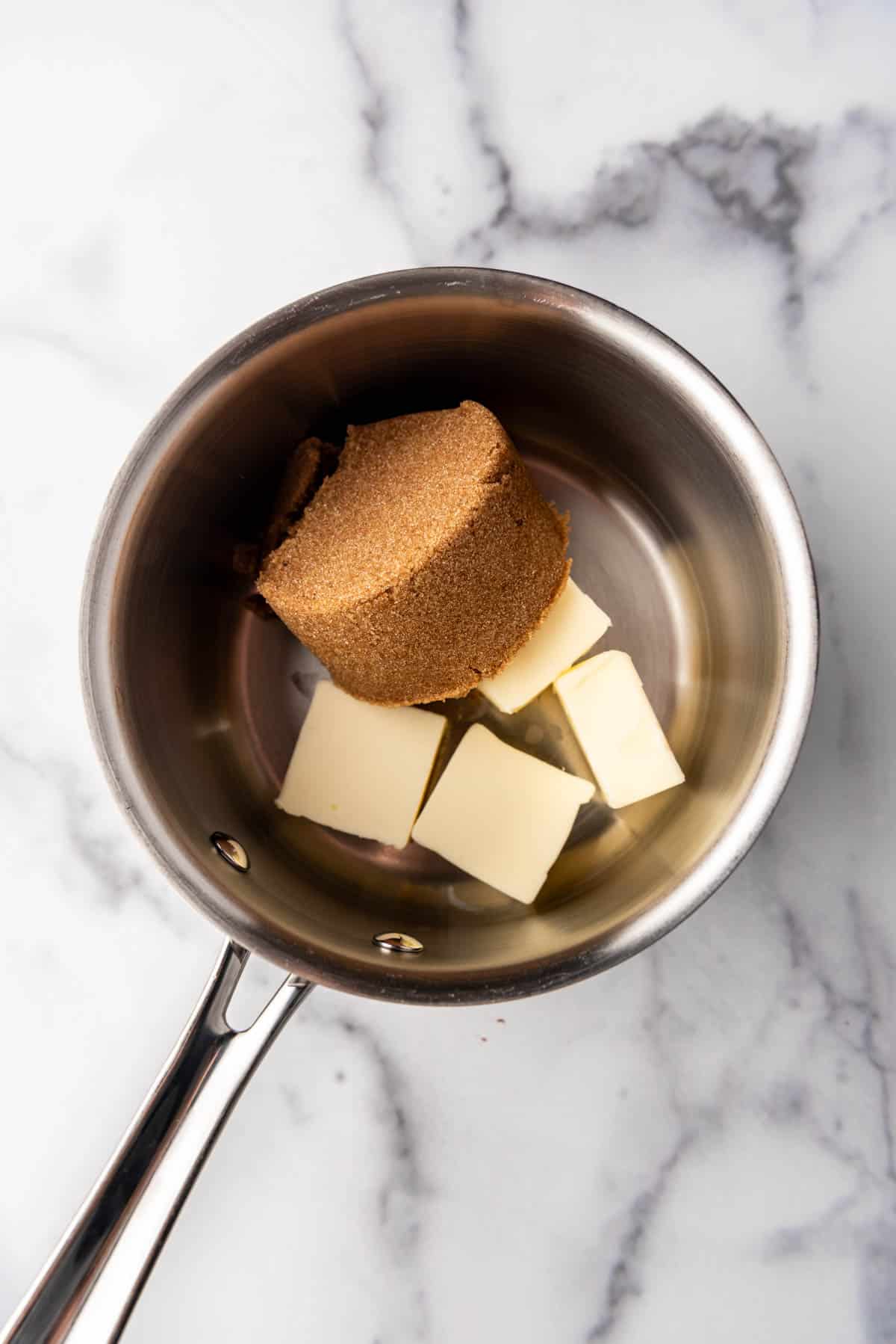 Combining brown sugar and butter in a medium saucepan.